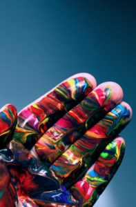 hand with multi color paint on it